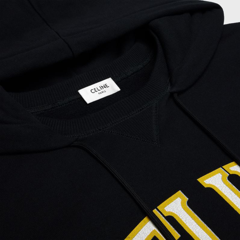 CELINE Kvinder oversized hættetrøje i bomuldsfleece F44FV669 beklædning sort/gul/hvid